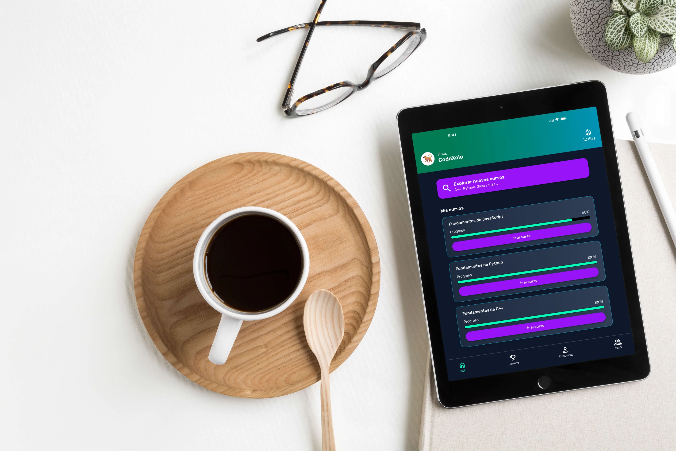 Tablet on a white desk showing the LearnCode Home screen with enrolled courses, progress bars and a 12-day streak